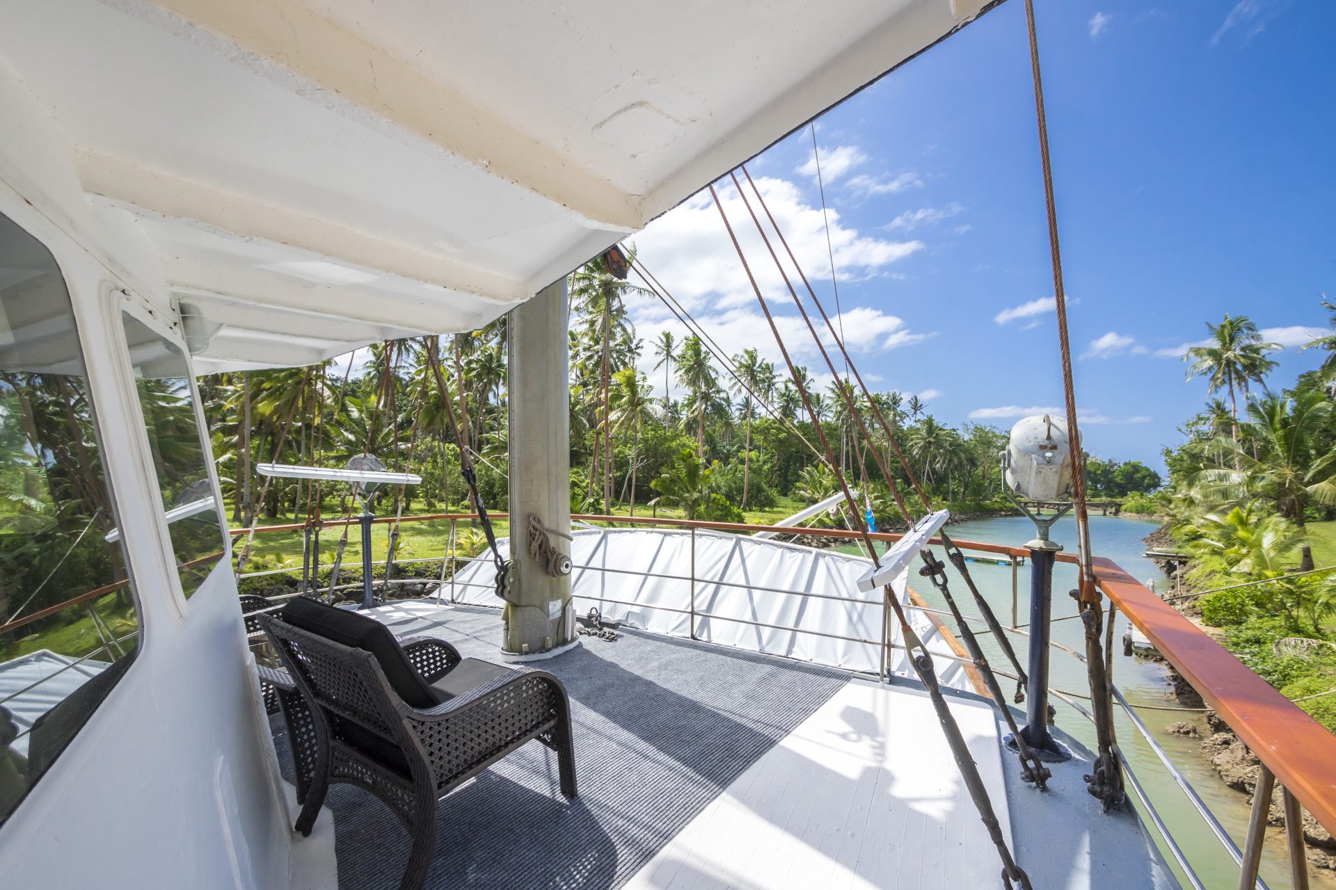 view from deck of yacht overlooking tropical lagoon