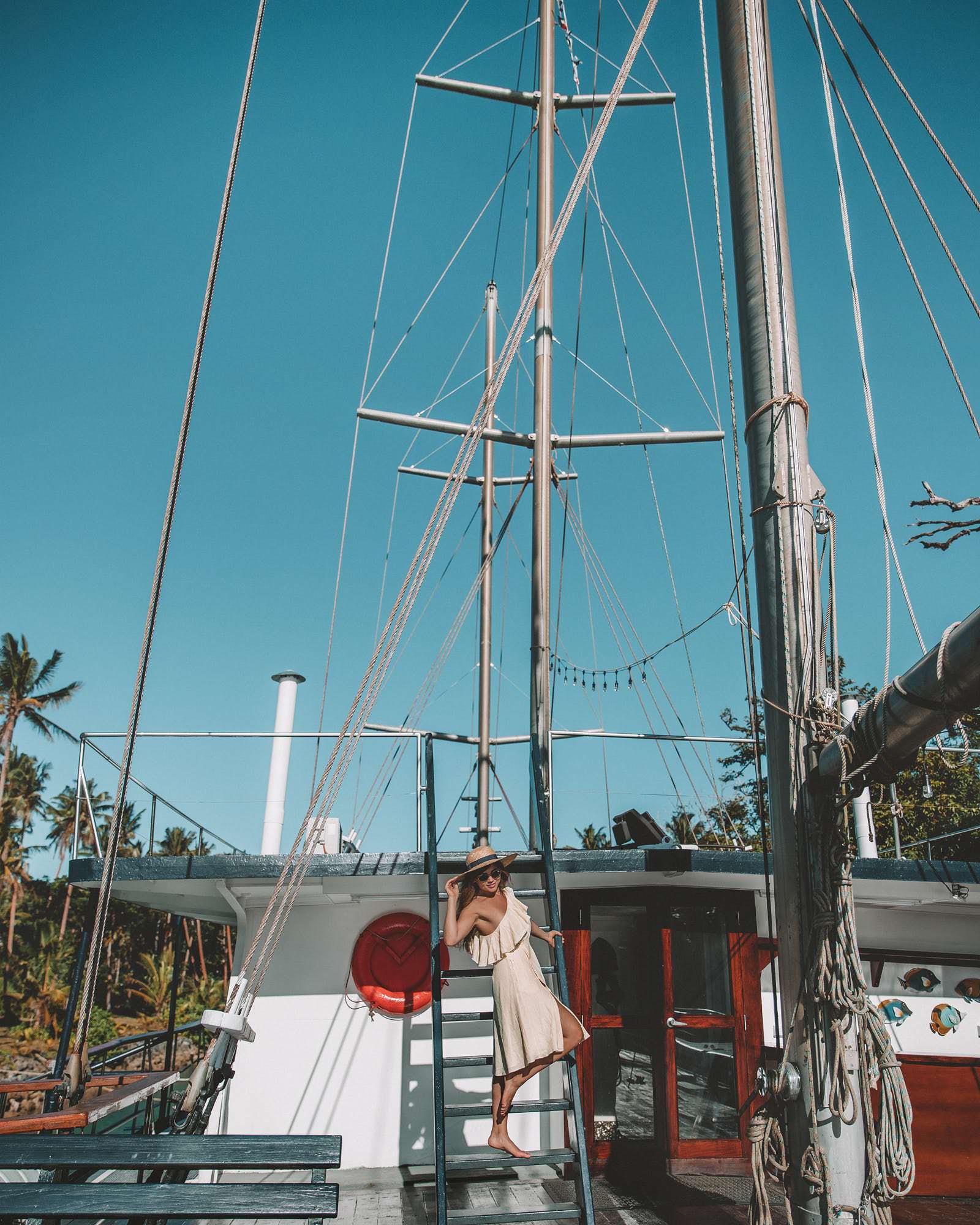 woman standing on stairs of private fiji yacht